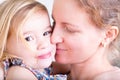 Loving mother kissing her little daughter Royalty Free Stock Photo