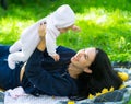 Loving mother laughing as she plays with her baby. Royalty Free Stock Photo