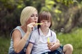 Loving Mother and Special Boy Playing Soap Bubbles