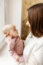 Young mother with her newborn baby at home. Happy family concept. Royalty Free Stock Photo