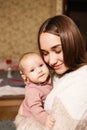 Young mother with her newborn baby at home. Happy family concept. Royalty Free Stock Photo