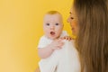 Loving mother takes care of a newborn baby at home. portrait of a happy mother holding a sweet son in her arms Royalty Free Stock Photo