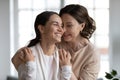 Loving older mom hug smiling grownup daughter Royalty Free Stock Photo