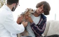 Loving owner with a Yorkshire terrier in the office of a veterinarian