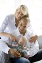 Loving parents with sleeping baby in dad's lap Royalty Free Stock Photo