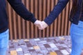 Loving people firmly hold hands and overcame each other, standin Royalty Free Stock Photo