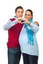 Loving pregnant couple forming heart Royalty Free Stock Photo