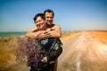 Loving Retired Couple Hugging Standing By Shore On Beach Vacation Royalty Free Stock Photo