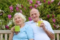 Loving senior couple drinking tea in the garden Royalty Free Stock Photo