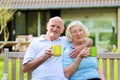 Loving senior couple drinking tea in the garden Royalty Free Stock Photo