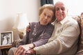 Loving Senior Couple Relaxing At Home Royalty Free Stock Photo