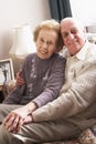 Loving Senior Couple Relaxing At Home