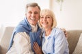 Loving senior couple smiling happily at camera Royalty Free Stock Photo