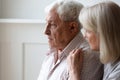 Loving senior wife hug comfort sad elderly husband Royalty Free Stock Photo