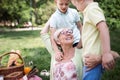Loving senior woman embracing her grandchildren with a cheerful smile on her face Royalty Free Stock Photo