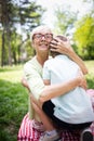 Loving senior woman embracing her grandchildren with a cheerful smile on her face Royalty Free Stock Photo