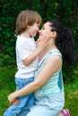 Loving son kissing his happy mother on the nose Royalty Free Stock Photo