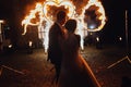 Loving wedding couple watching fire-show Royalty Free Stock Photo