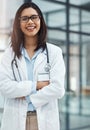 Loving what you do makes all the difference. Portrait of a confident young doctor working in a modern hospital. Royalty Free Stock Photo
