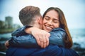 Loving you feels so good. a happy young couple embracing outdoors. Royalty Free Stock Photo