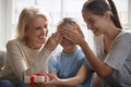 Loving mother and grandmother greeting child with birthday Royalty Free Stock Photo