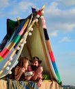 Loving young coupl eating near camp tent. Camping couple in love. Couples of lovers tourists relax on nature. Camping Royalty Free Stock Photo