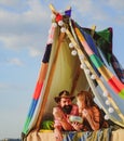 Loving young coupl eating near camp tent. Camping couple in love. Couples of lovers tourists relax on nature. Camping Royalty Free Stock Photo