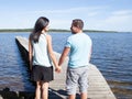 Loving young couple at the beach pontoon Royalty Free Stock Photo