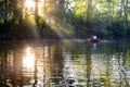 Loving young couple in boat at lake having romantic time. Royalty Free Stock Photo