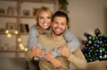 Loving young couple celebrating xmas together at home Royalty Free Stock Photo