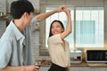 Loving young couple dancing in modern kitchen, spending free weekend time together at home Royalty Free Stock Photo