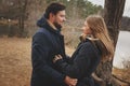 Loving young couple happy together outdoor on cozy warm walk in autumn forest Royalty Free Stock Photo