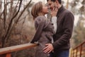 Loving young couple happy together outdoor on cozy warm walk in autumn forest Royalty Free Stock Photo