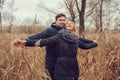 Loving young couple happy together outdoor on cozy warm walk in autumn forest Royalty Free Stock Photo