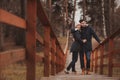 Loving young couple happy together outdoor on cozy warm walk in forest Royalty Free Stock Photo