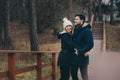 Loving young couple happy together outdoor on cozy warm walk in forest Royalty Free Stock Photo