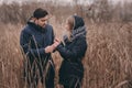 Loving young couple happy together outdoor on cozy warm walk in forest Royalty Free Stock Photo