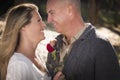 Loving Young Couple Holding a Rose Royalty Free Stock Photo