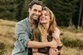 Loving young couple hugging and smiling together on nature background Royalty Free Stock Photo