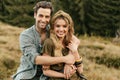 Loving young couple hugging and smiling together on nature background Royalty Free Stock Photo