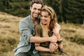 Loving young couple hugging and smiling together on nature background Royalty Free Stock Photo