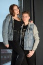 Young couple in jeans jackets together