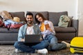 Loving young couple planning trip after quarantine having tickets online reservation, using laptop and booking hotel Royalty Free Stock Photo
