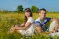 Loving young couple sitting in the sunlight