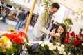 Loving couple smelling roses in Rome, Italy