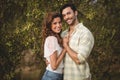 Loving young couple standing by trees at olive farm Royalty Free Stock Photo