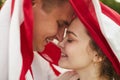 Loving Young Couple Under American Flag Royalty Free Stock Photo