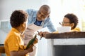 Loving young father asking his sons to behave themselves Royalty Free Stock Photo