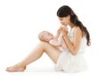Loving young mother kissing feet her baby Royalty Free Stock Photo