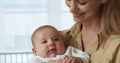 Loving mother sings lullaby to sweet baby